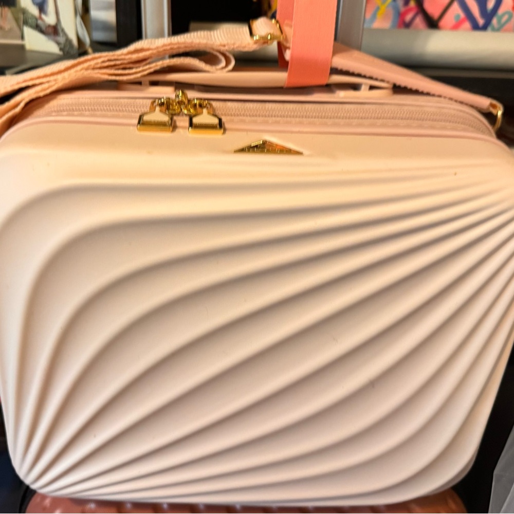 Pink Travel Bag with Sculptural Wave Design